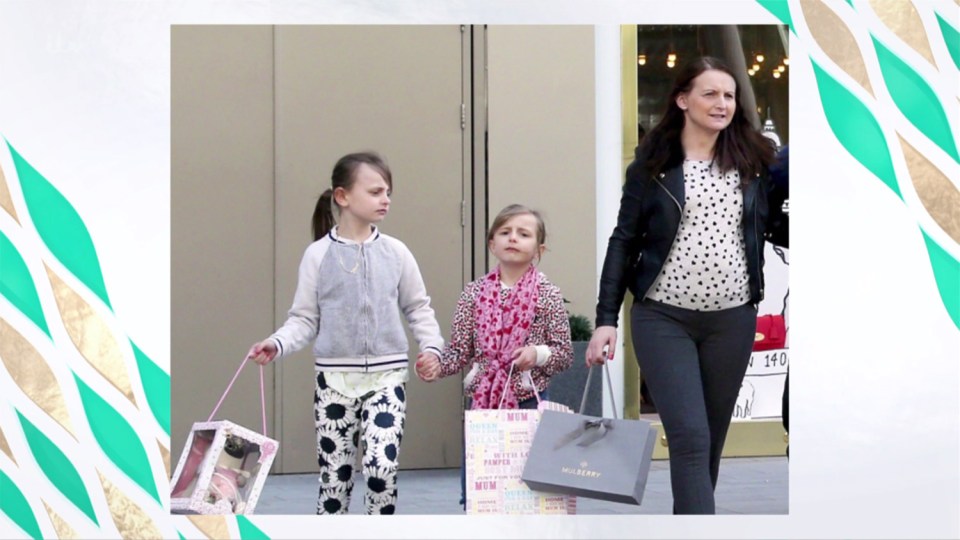  Cheryl and two of her children leaving Mulberry store with designer handbag gift