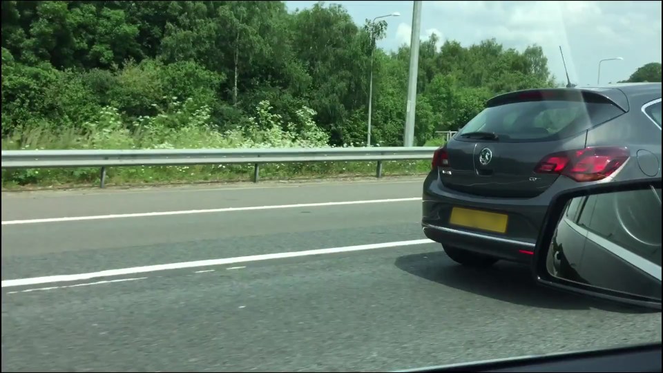  Another motorist approached the Vauxhall Astra as its passenger positioned their camera to capture the footage