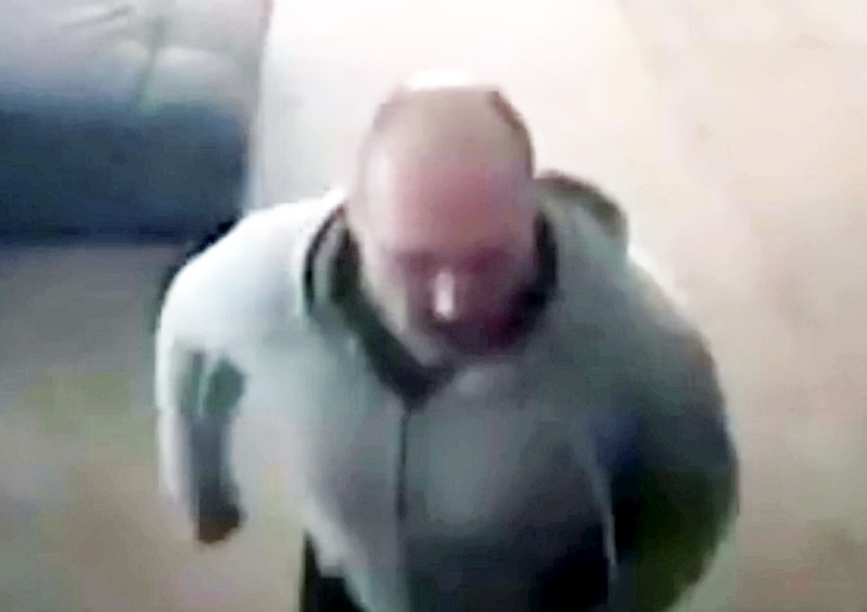  The stocky, shaven headed robber can be clearly seen on the home owner's CCTV