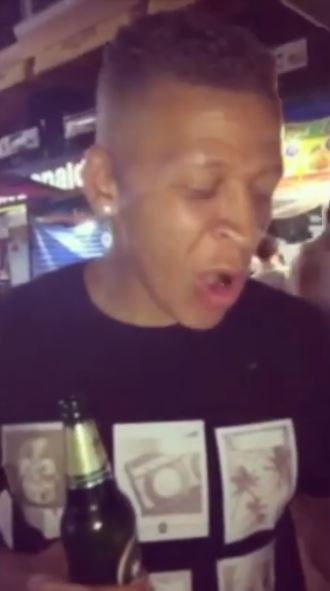  Dwight Gayle grimaces after taking a bite of a cricket in Bangkok