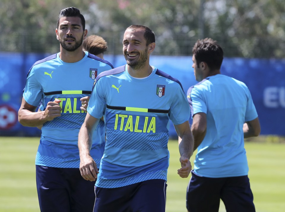 Giorgio Chiellini grins as he trains with Southampton striker Graziano Pelle