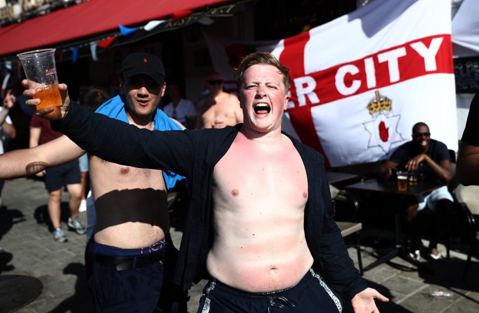  One passionate fan sports some serious sunburn and shouts for the camera