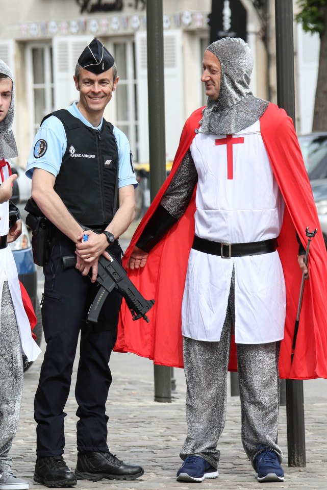  The pair joke around with French police, who were last night trying to keep control when England fans clashed with local youths in Marseille