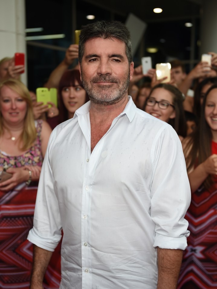 Simon has yet to shave off that beard