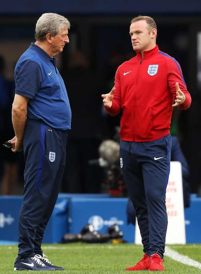  Two minds are better...Roy Hodgson and skipper Wayne Rooney discuss tactics