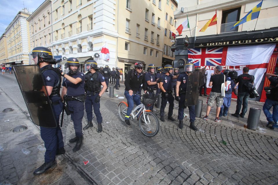  A police stand in...ahead of first game