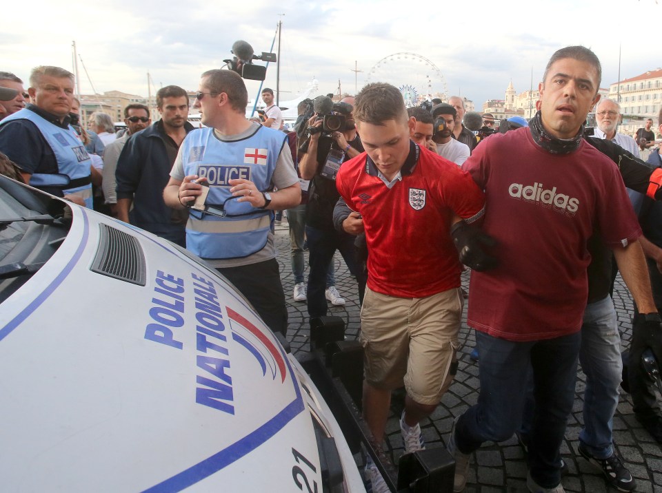  England football fan is is taken away by French police...in the old town