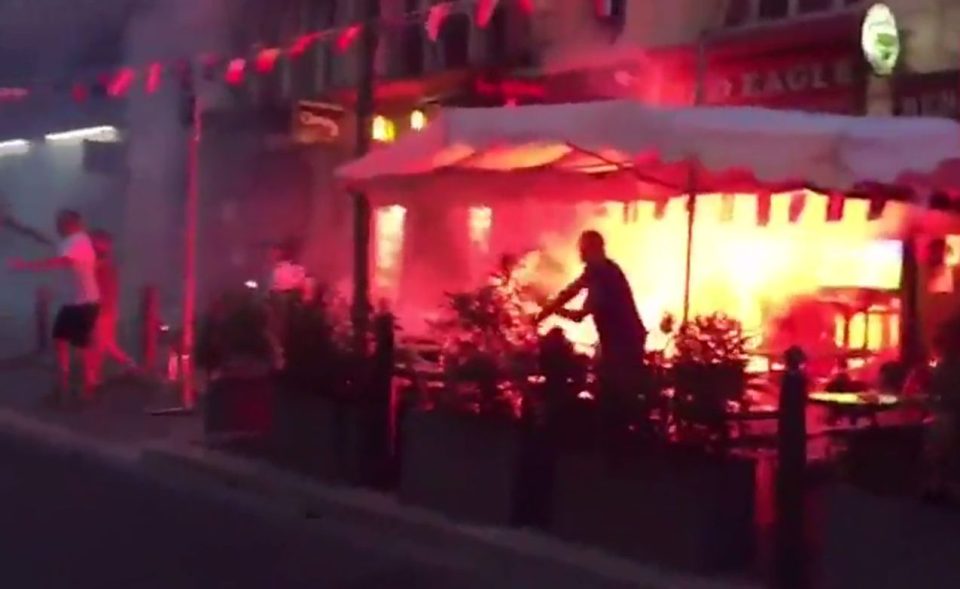  A cafe is engulfed in flames...in new bout of violence