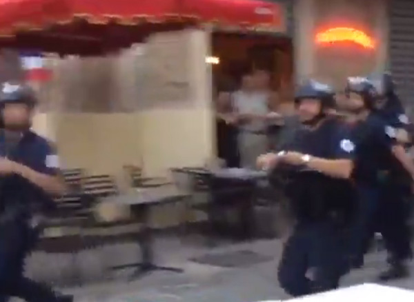  French riot police are soon on the scene as the thugs escape down a side street leaving the England fans to face the cops