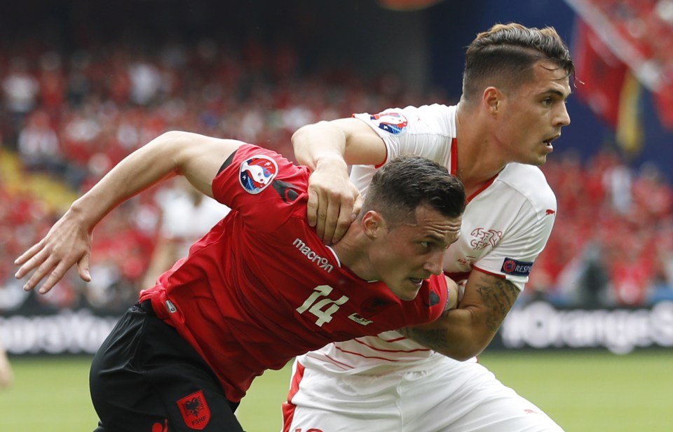  Granit Xhaka gets a hold of his brother Taulant who represents Albania