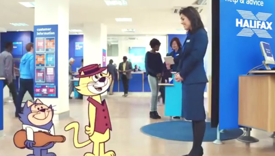  Tiffany, as a happy Halifax worker, greets Top Cat at his local branch