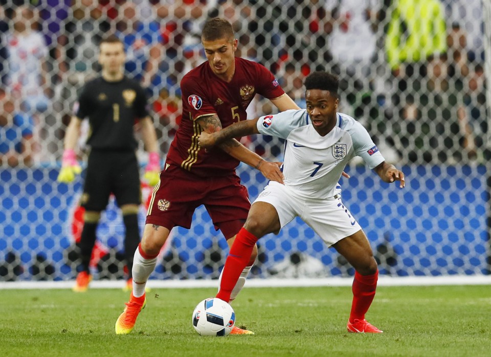  Former German, Roman Neustadter, tussles with Raheem Sterling in Euro 2016 opener