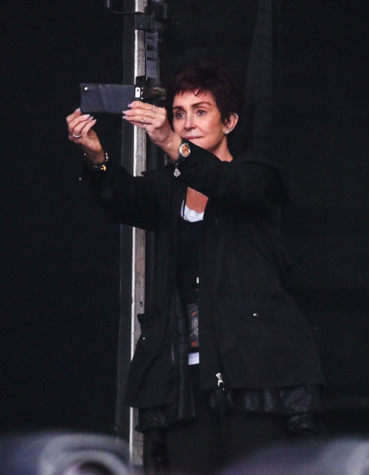  She was snapped taking selfies at the side of the stage