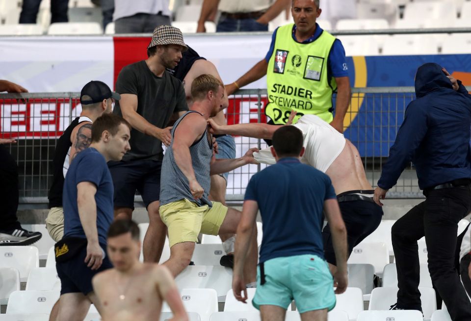 Supporters fight at the end of the Euro