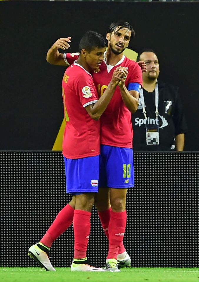 Venegas and Bryan Ruiz celebrate after Fabra's unfortunate own goal 