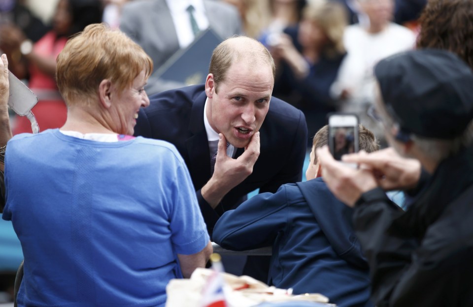 Britain's Prince Wlliam greets guests on the Mall