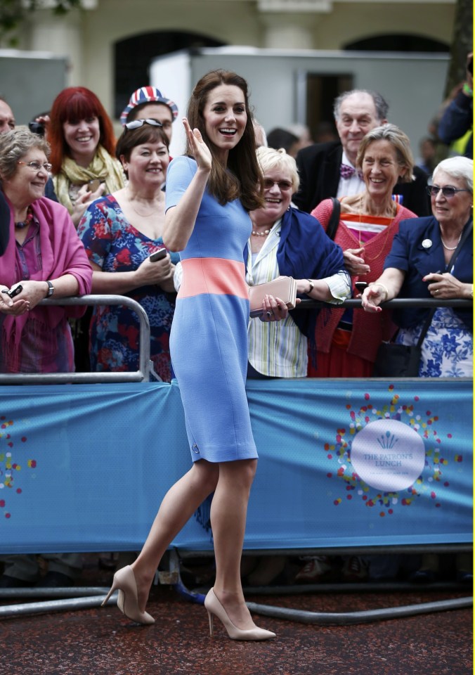 Britain's Kate the Duchess of Cambridge greets guests on the Mall as they attend the Patron's Lunch, an event to mark Queen Elizabeth's 90th birthday, in London