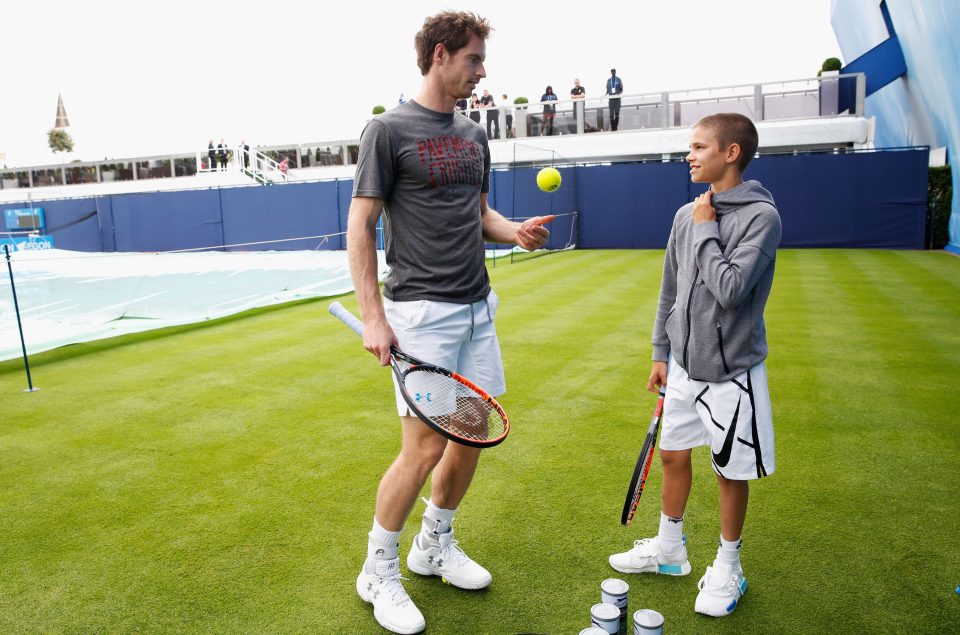  Andy Murray shares some advice with Romeo Beckham ahead of their knock-about at Queens Club where the Scot will go for his fifth title win