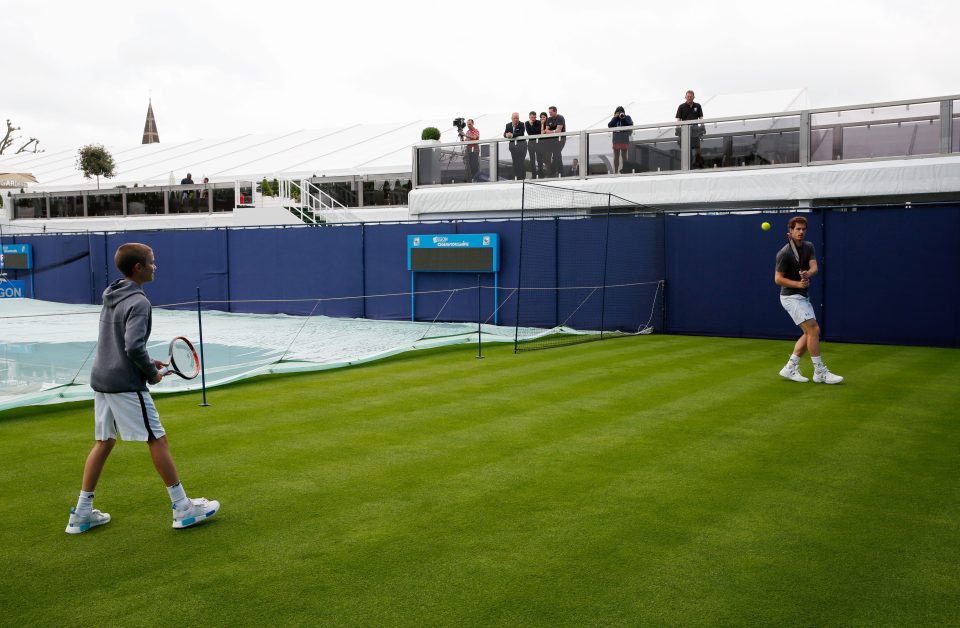  Andy Murray and Romeo Beckham return the ball at Queen's Club practice courts