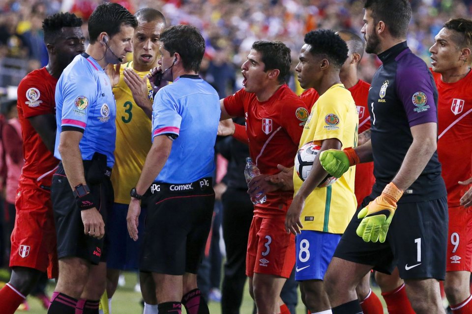  Brazil players contest referee's decision to allow Peru's controversial goal