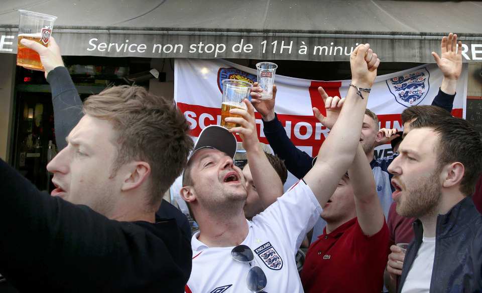  A beer-ly good time ... fans in Lille yesterday