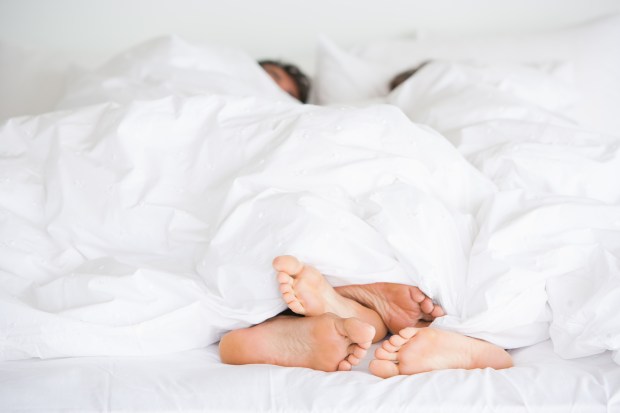 Anonymous photo of couple under blankets