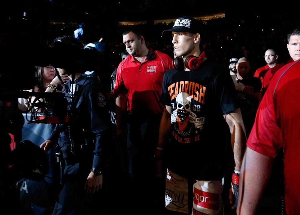  Making the walk: Rory MacDonald makes his way to the Octagon at UFC 174