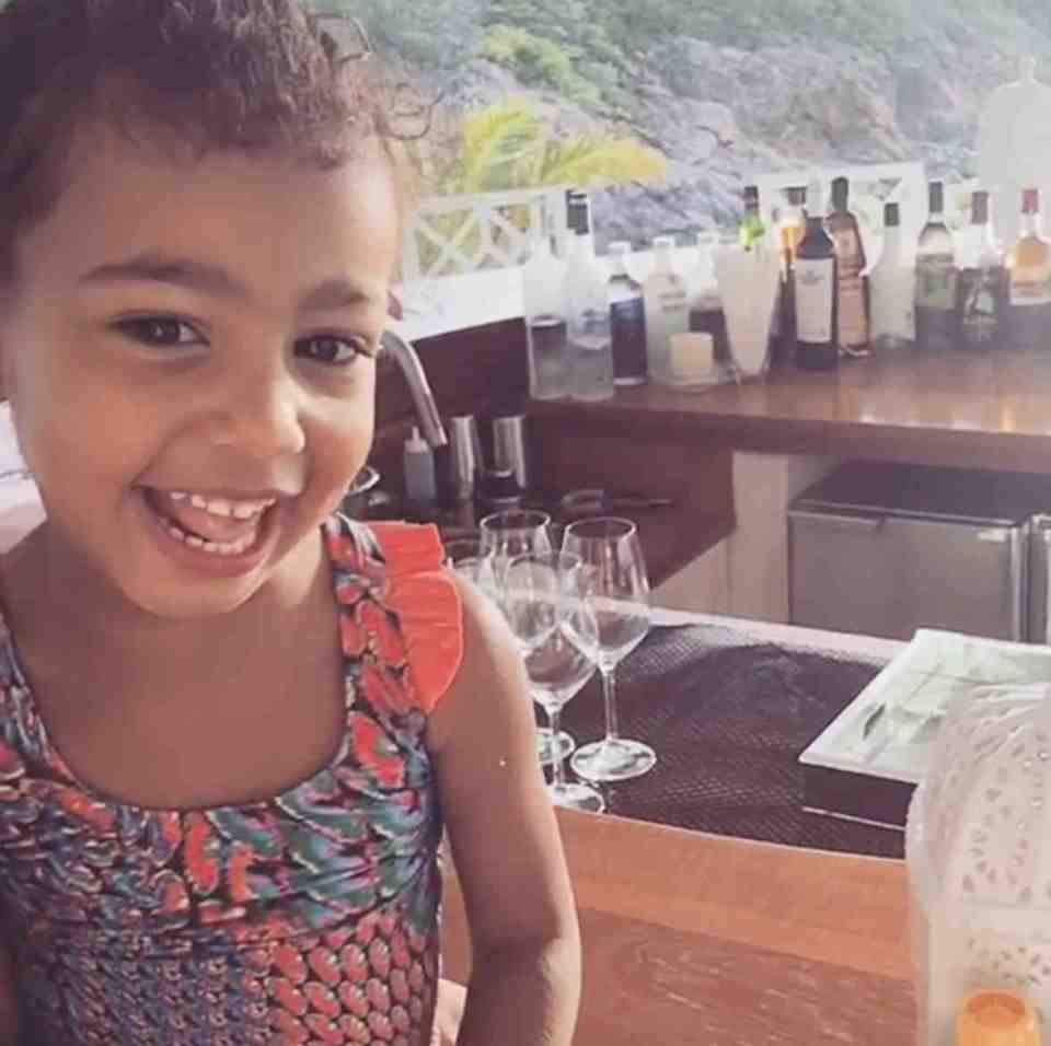  North flashes a big cheesy grin as she celebrates her third birthday