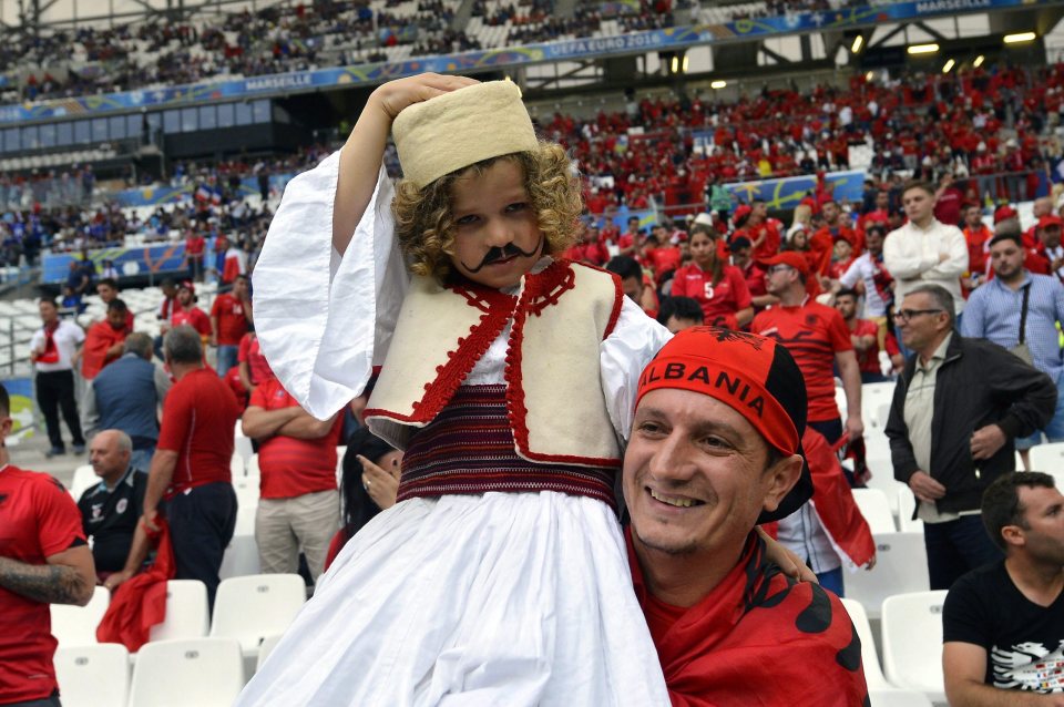  A young supporter wears traditional dress