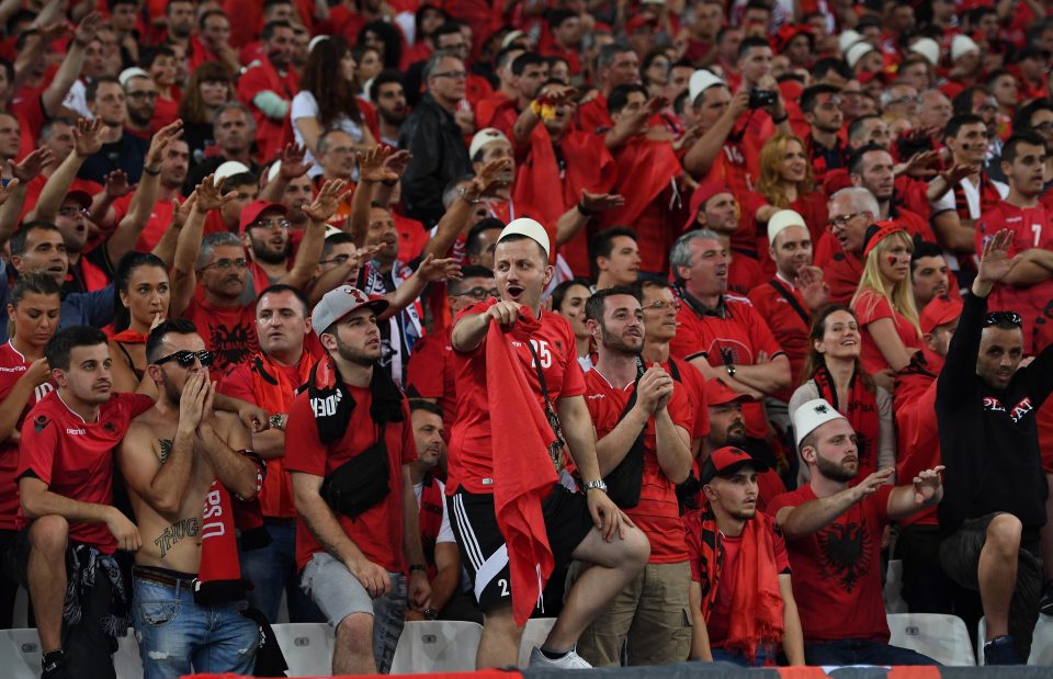  Albanian fans wear the traditional qeleshe hat