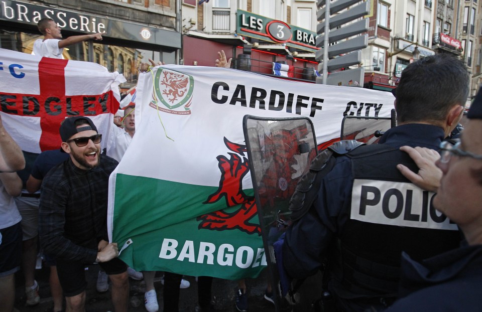  Excitement mounts ... fans gather outside of a bar in Lille yesterday