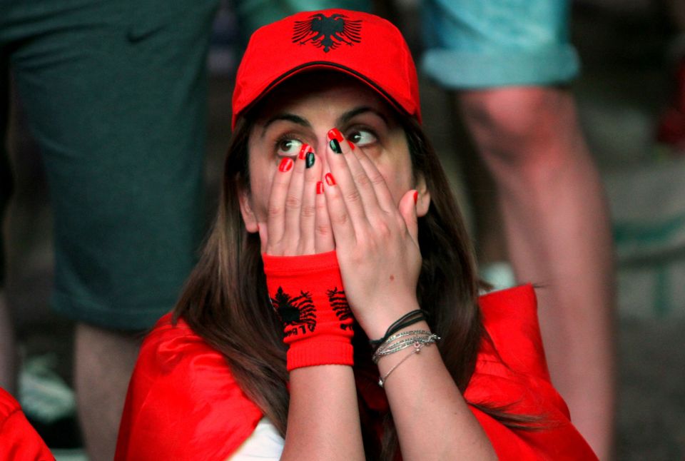  A fan reacts after watching Antoine Griezmann score a late goal