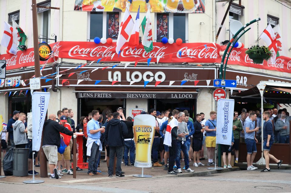  Fans enjoy a pre-match drink in Lens as kick-off approaches