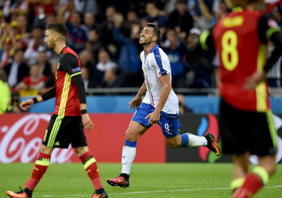  Italy beat Belgium in their opening game in Group E to finish top