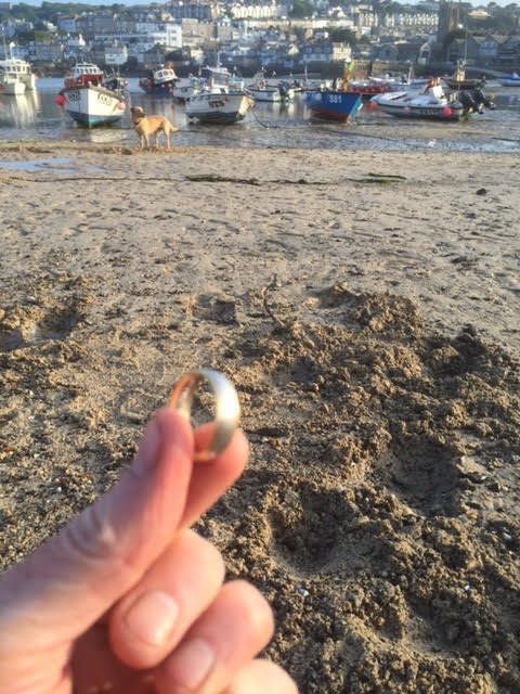  He was thrilled to track his ring down in the sand using his son's toy metal detector