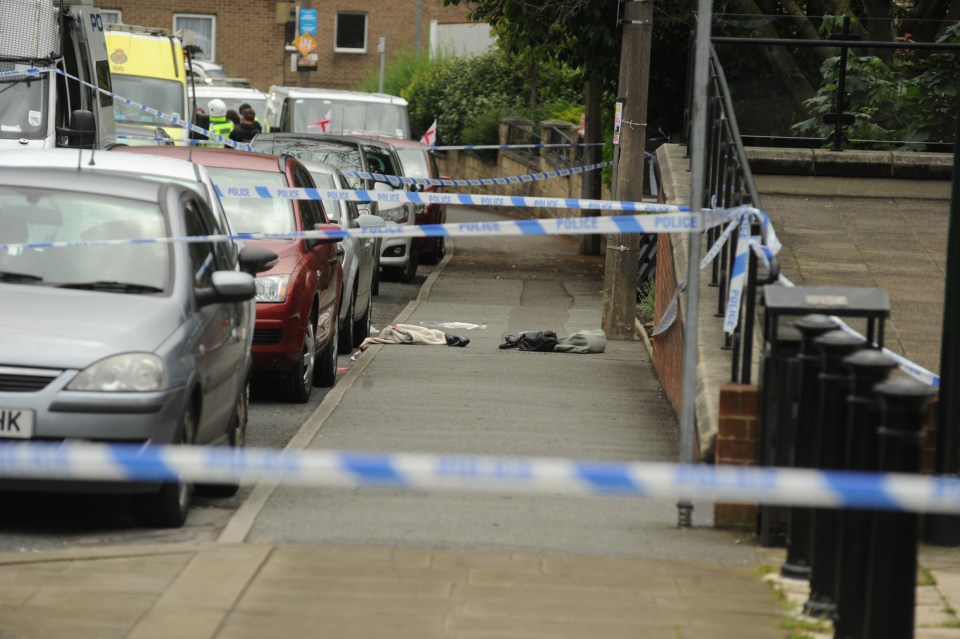  A bag and boots believed to belong to Mrs Cox lay on the pavement where she was stabbed and shot