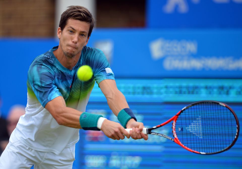  Aljaz Beden returns a backhand against Andy Murray at Queen's