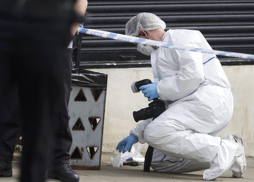  A forensics police officer works at the scene where the Labour MP Jo Cox was stabbed and shot dead