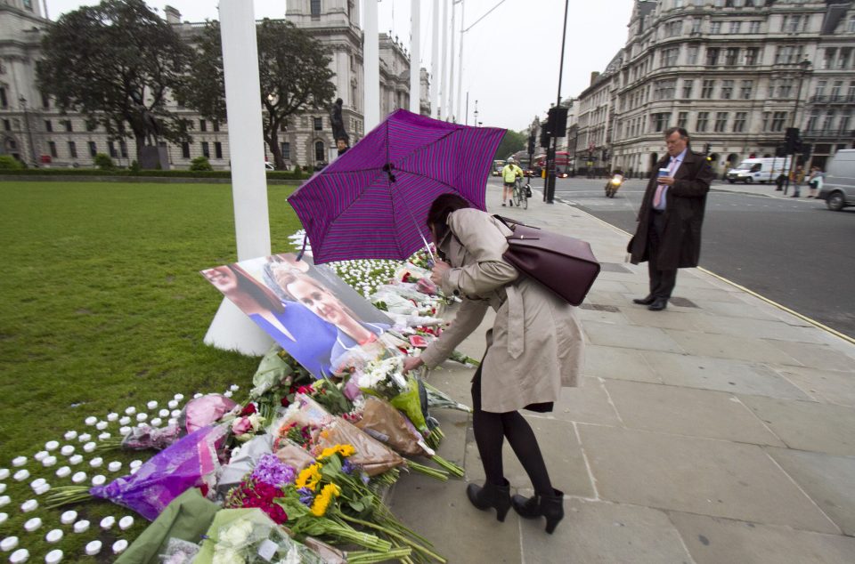  Floral tributes have been left outside Parliament for murdered MP Jo Cox in London