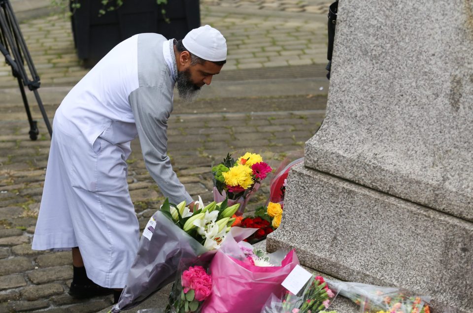  A man lays flowers Tributes left at the scene where Jo Cox MP was killed