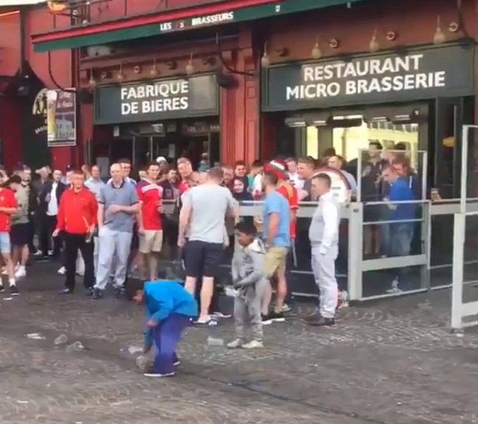  Beggar children run to pick up coins thrown by taunting England fans