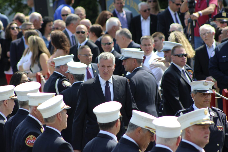 Firefighters stood to attention and saluted at Lawrence Stack's funeral