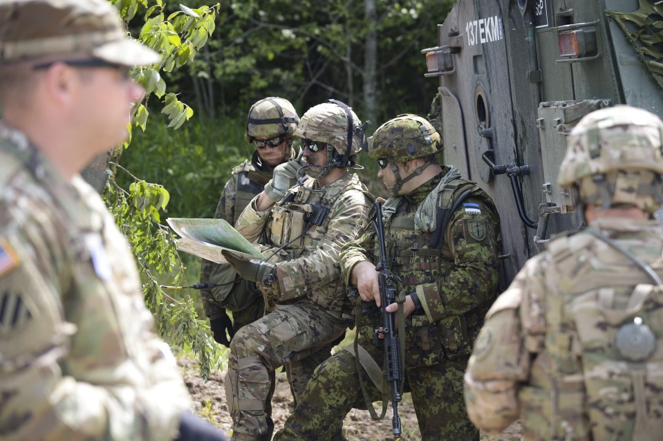  A Finnish, American and Estonian soldier participate in Operation Saber Strike earlier this month