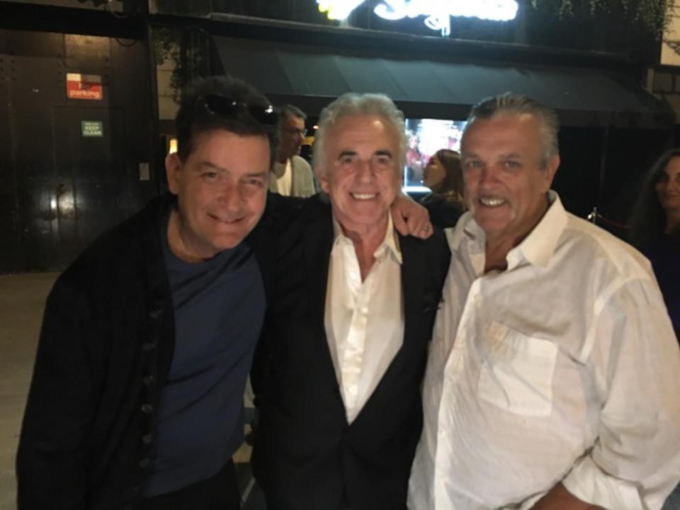  Party time ... Charlie Sheen with Peter Stringfellow, centre, at strip club