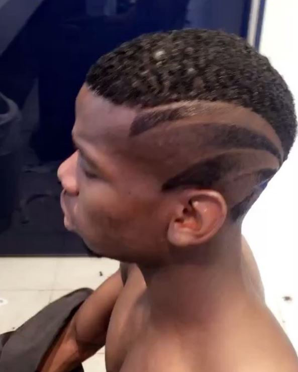 France midfielder Paul Pogba shows off his flashy new hair cut at Euro 2016