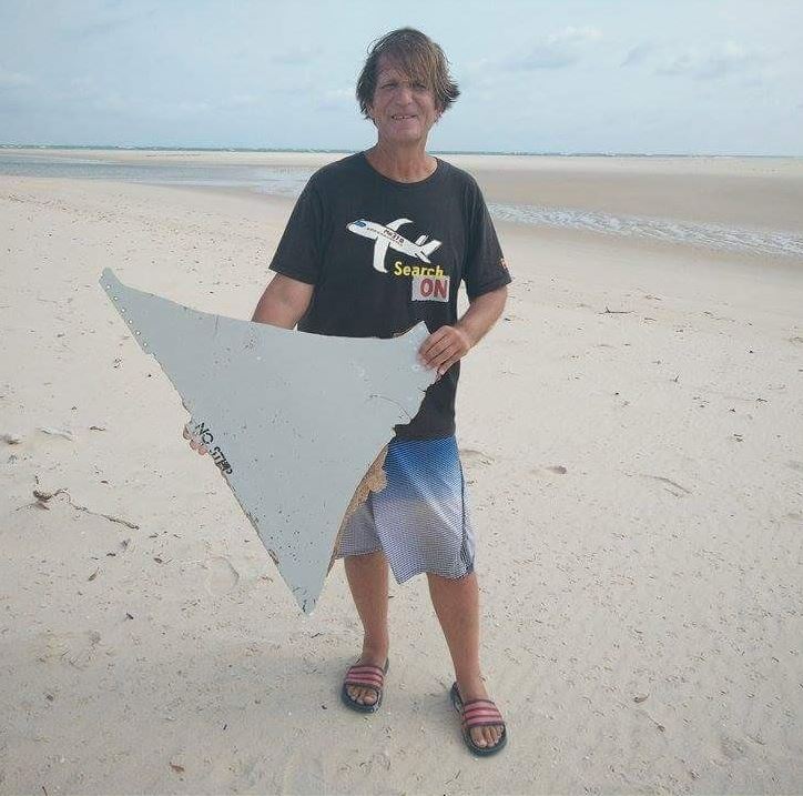  The lawyer, 58, holds a piece of wreckage discovered. It is believed to have come from the wreck of MH370