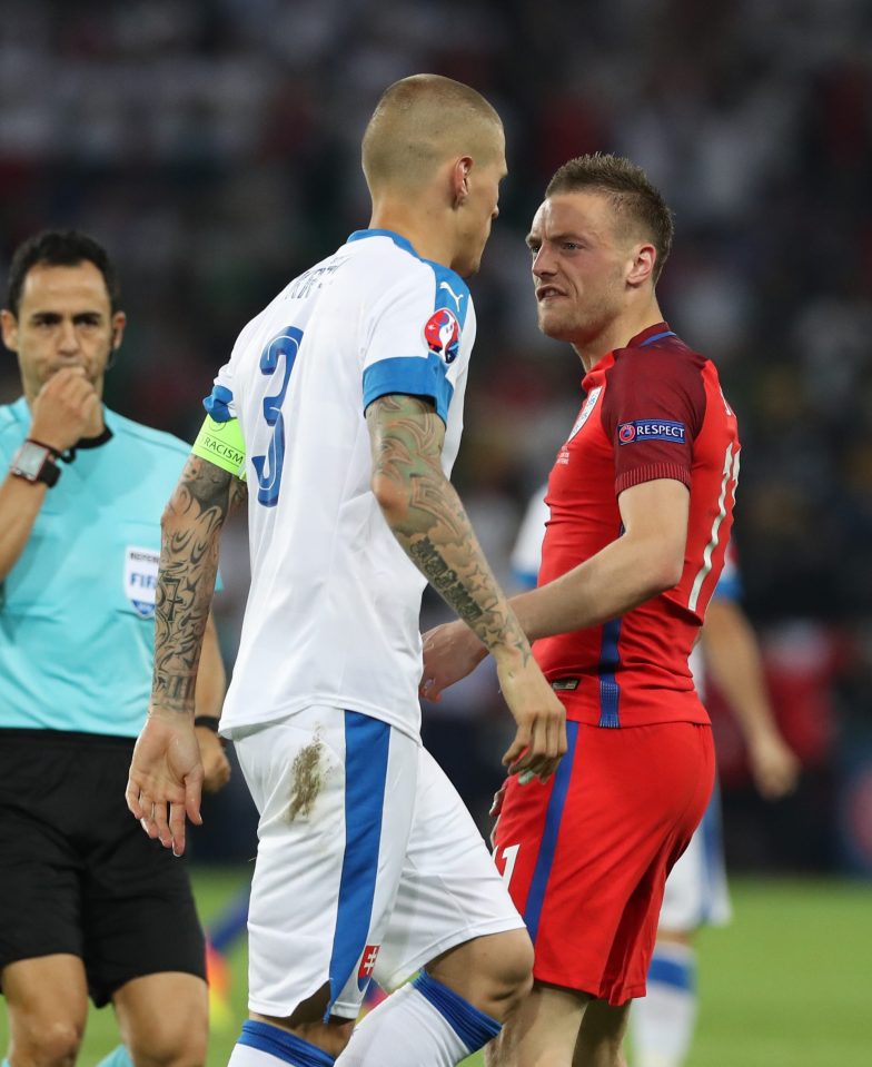  Vardy exchanges words with Loverpool's Slovakian defender Martin Skrtel