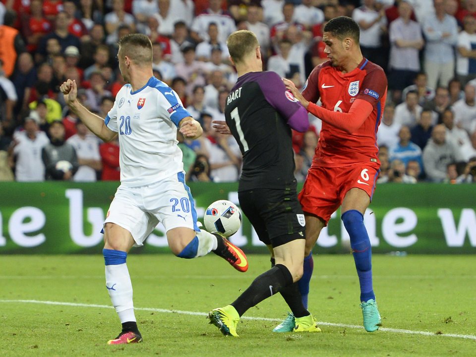 Chris Smalling chests past Joe Hart with Robert Mak ready to pounce