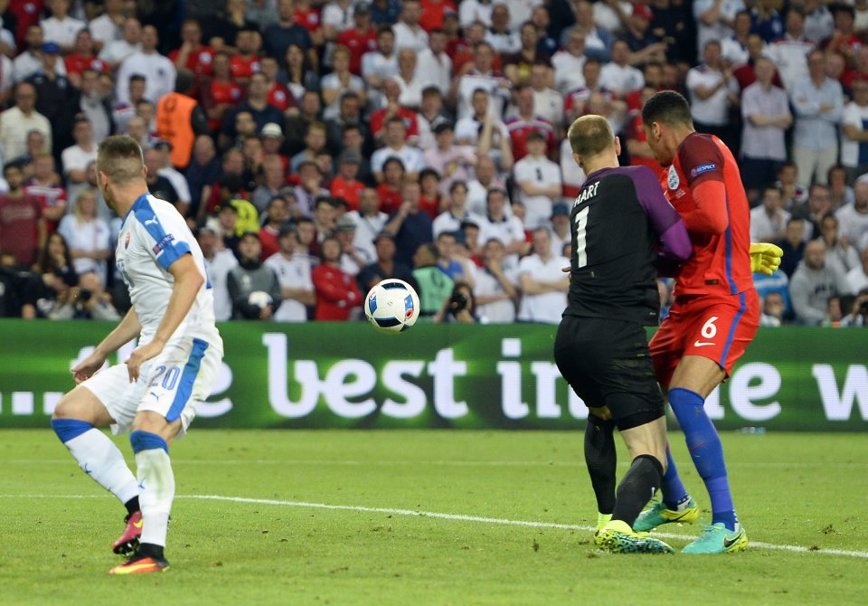 Smalling and Hart watch on as Mak misses the chance to put Slovakia into the lead