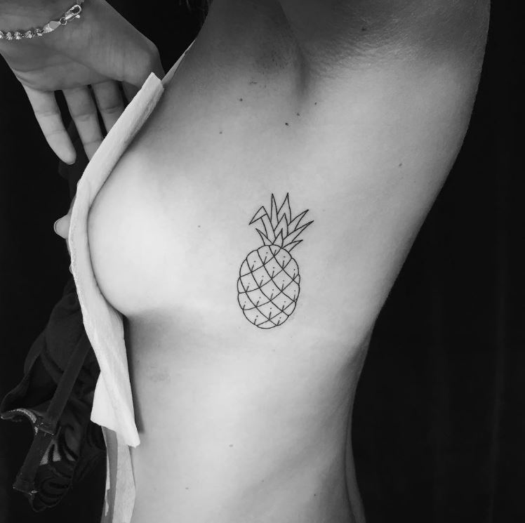  Feeling juicy? A woman flaunts her pineapple inking